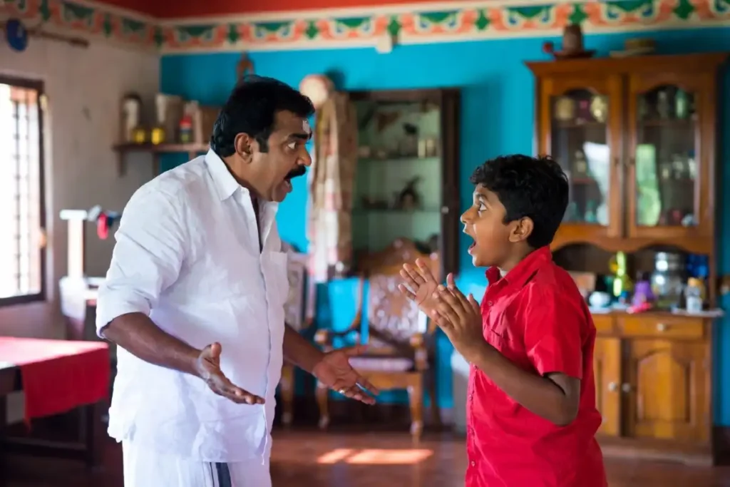 Ashakal Aayiram family comedy drama scene with father and son in a humorous moment