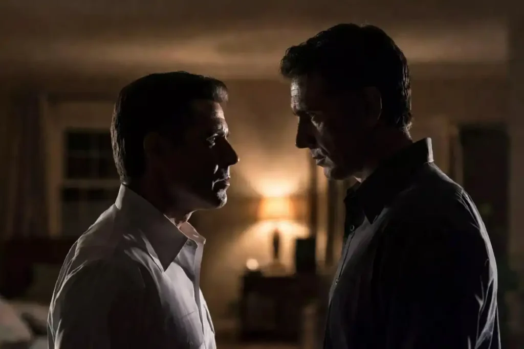 Two male actors in a tense standoff scene representing the central conflict in The Rip 2026