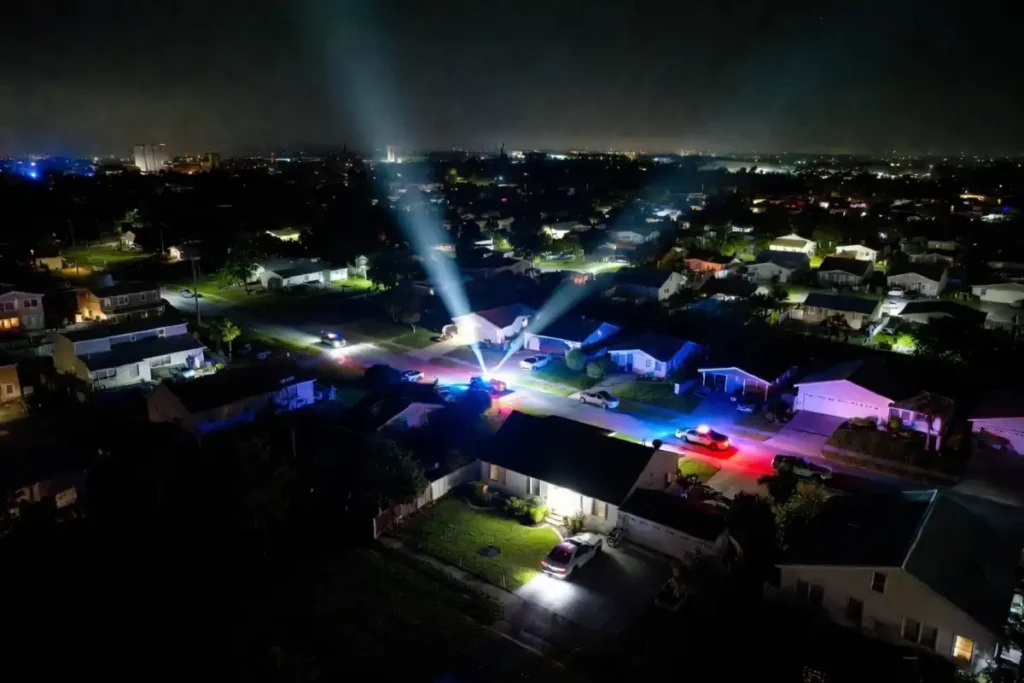 Crime thriller scene showing cops investigating a Miami stash house at night in The Rip 2026